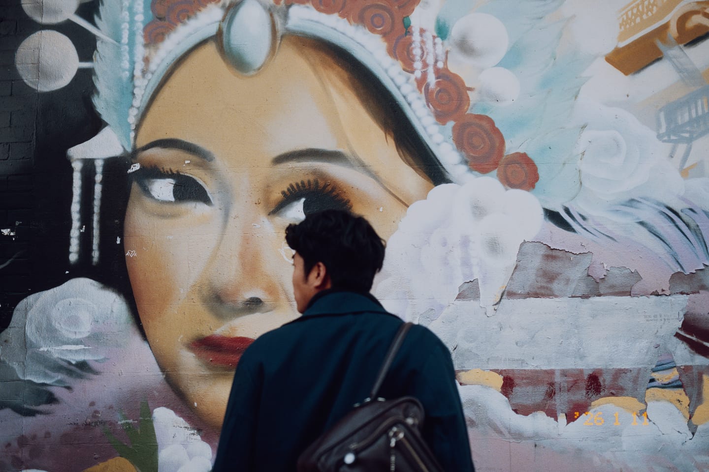 A passer-by in front of a painted mural, Kodak Portra 400 without Film Edge, printed on Kodak Ultra Endura.
