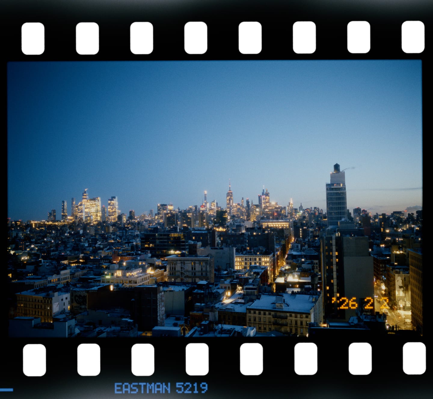 Lower Manhattan at dusk on Kodak Vision3 500T, 135, with the date exposed into the frame.