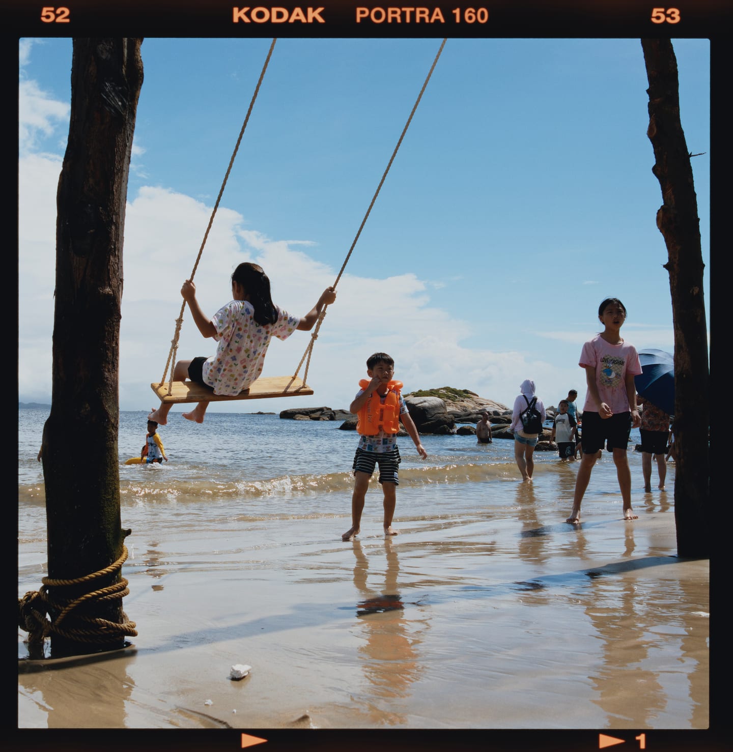 Children on a beach swing, Kodak Portra 160 on 6×6, printed on Kodak Portra Endura.