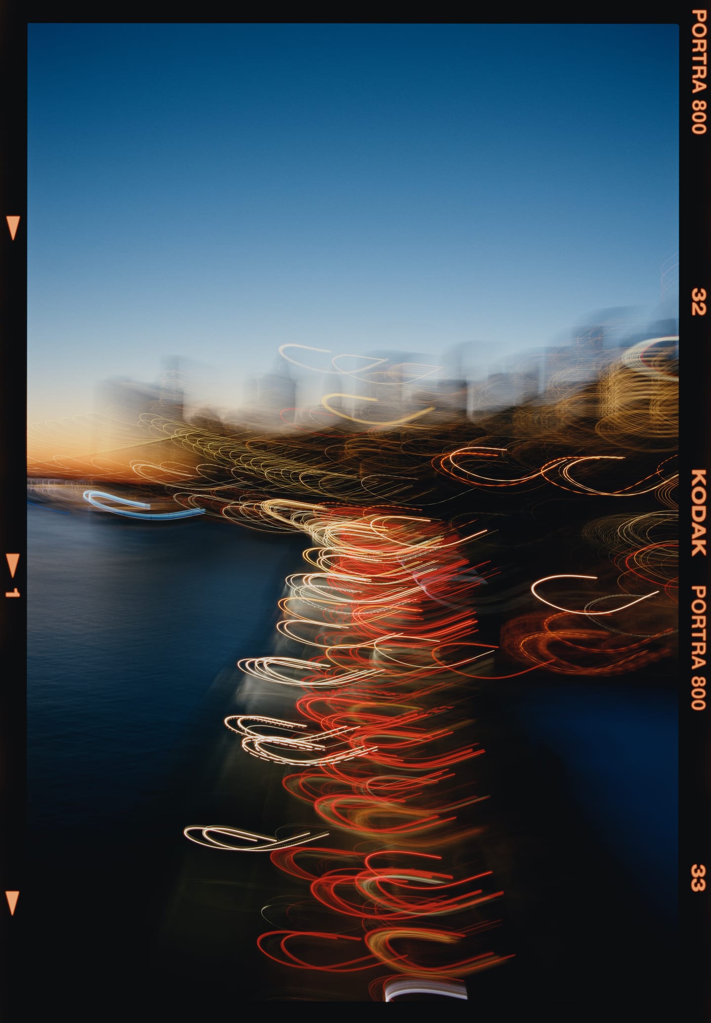 Light trails over water at night, Kodak Portra 800 on 6×9.