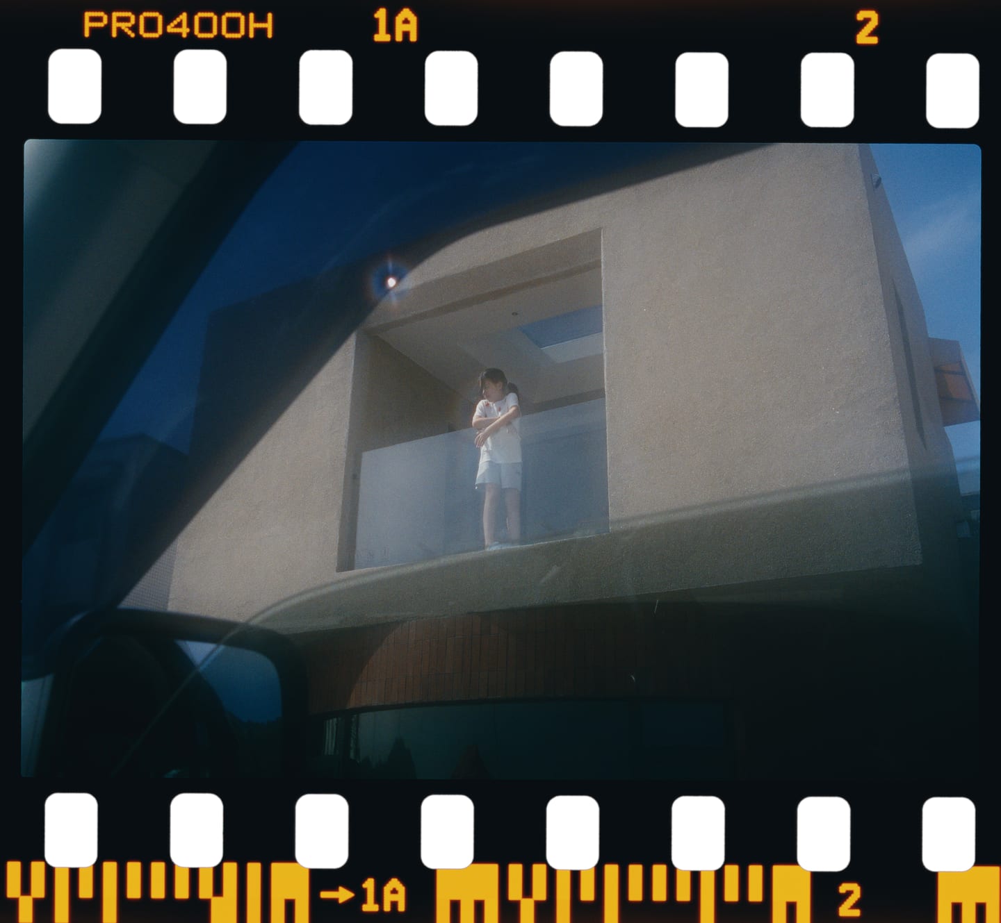 A figure at a window, Fujifilm Pro 400H on a 135 strip.